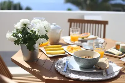 a bathroom with a sink with towels on a counter at SeaShell Romantic - Balcony with Ocean View & Pool in Funchal