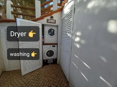 a laundry room with a washer and a washing machine at Martins Apartment - Belch1952 in Lagos