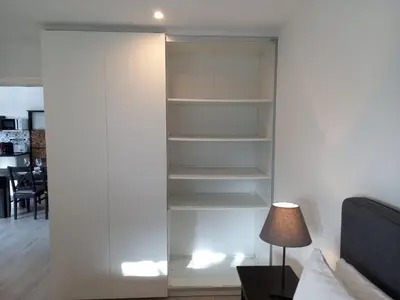 a built in book shelf in a living room at Martins Apartment - Belch1952 in Lagos