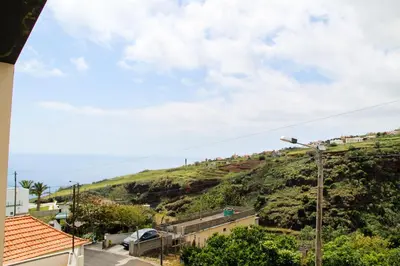 a view of a hill from a house at Casa Simão in Calheta