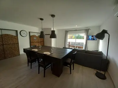 a living room with a table and a couch at Belchior Apartment - Belch1952 in Lagos