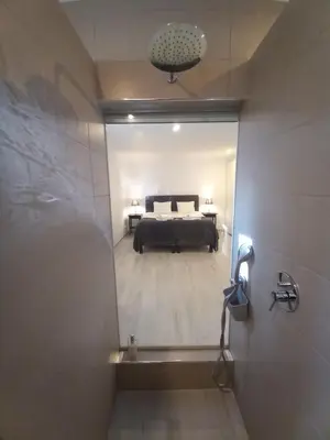 a view of a bedroom from a bathroom with a bed at Belchior Apartment - Belch1952 in Lagos
