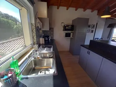 a kitchen with a sink and a window at Carlos Apartment - Penthouse - Belch1952 in Lagos