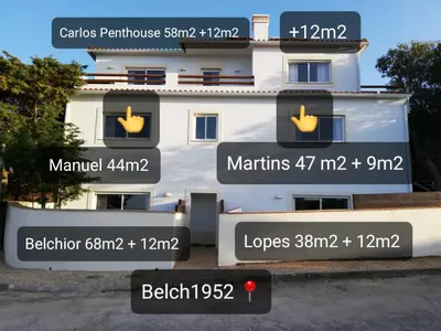 a white building with signs on the side of it at Carlos Apartment - Penthouse - Belch1952 in Lagos