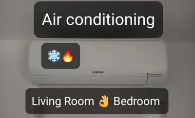 a sign with an air conditioning living room and bathroom at Lopes Apartment - Belch1952 in Lagos