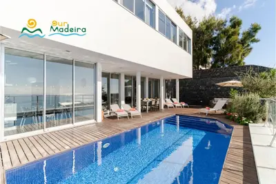 a villa with a swimming pool and a house at OurMadeira - Fonte do Mar 1 in Caniço