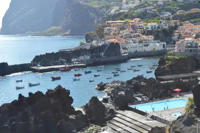 a group of boats in a body of water at Apartment in Câmara de Lobos in Câmara de Lobos