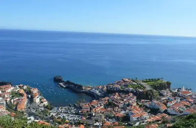 an aerial view of a town next to the ocean at Apartment in Câmara de Lobos in Câmara de Lobos
