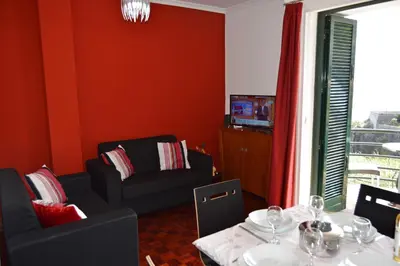 a living room with a couch and a table at Apartment in Câmara de Lobos in Câmara de Lobos