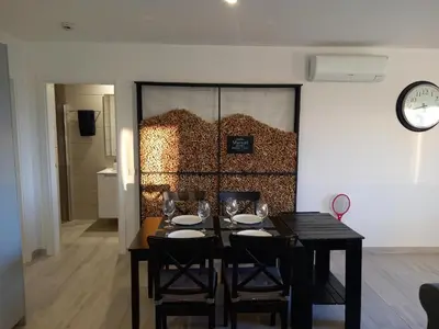 a dining room with a table and some wine glasses at Manuel Apartment - Belch1952 in Lagos