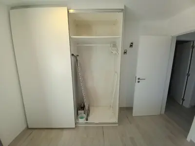 a white bathroom with a mirror in a room at Manuel Apartment - Belch1952 in Lagos