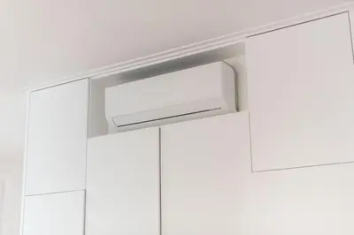 a flush showerhead in a bathroom with white cabinets at Apartamentos Praça Amarela by Heart of Funchal in Funchal