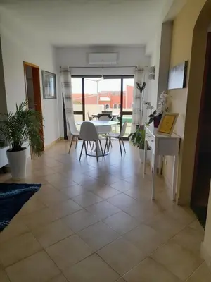 a living room with a table and chairs at Apartamento Maria in Lagos