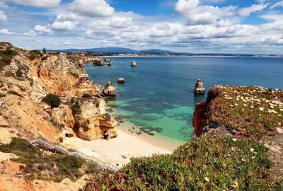 a view of a beach with rocks in the water at Apartamento Maria in Lagos