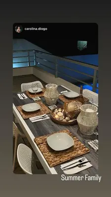 a table with plates and utensils on it at DuMar Beachouse in Salema