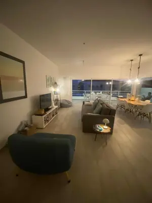 a living room with a couch and a table at DuMar Beachouse in Salema