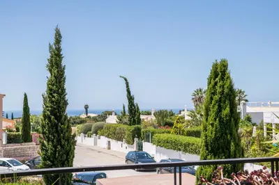 a view from the balcony of a house with trees at Mar da Luz Terrace Apt 118 in Lagos