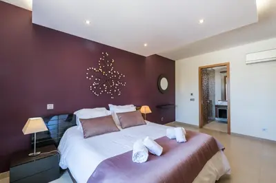 a bedroom with a large bed with towels on it at Mar da Luz Terrace Apt 118 in Lagos