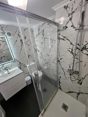 a bathroom with a shower and a toilet and a sink at Apartment in the city of Funchal up 2 at 6 pers in Gaula