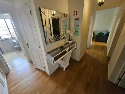 a hallway with a sink and a mirror on a wall at Apartment in the city of Funchal up 2 at 6 pers in Gaula