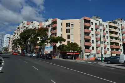 an empty street with cars parked on the side of a building at Apartment in the city of Funchal up 2 at 6 pers in Gaula
