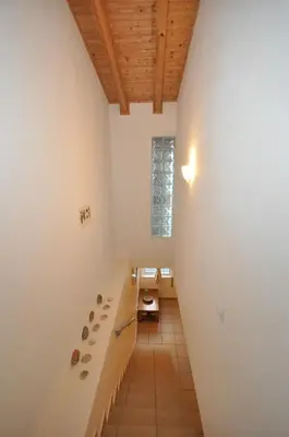 a hallway with a long bench in a room at Casa Azul in Barão de São João