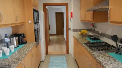 a kitchen with a stove and a counter top at Jasmineiro - Palms Palace Apartment in Funchal