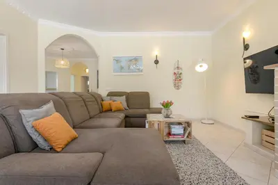 a living room with a couch and a table at Casa Naboo - Sunny Holiday Home with Pool in Aljezur