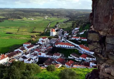 a view of a village from a mountain at Casa Naboo - Sunny Holiday Home with Pool in Aljezur