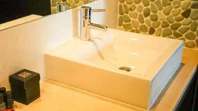 a bathroom sink with a faucet on a counter at Luxury 3-bedroom apartment at high-end Praia da Luz in Luz
