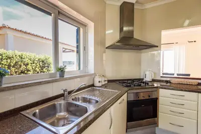 a kitchen with a sink and a window at Villa Acacias 13 in Luz