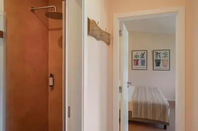 a hallway with a door leading to a bedroom at Casas do Lanço by An Island Apart in São Vicente