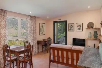 a living room with a couch and a table at Casas do Lanço by An Island Apart in São Vicente