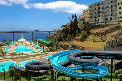 a water park with two pools and a water slide at Apartamento Estefânia in Santa Cruz