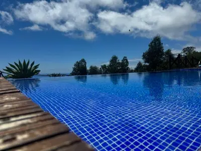 a large swimming pool with blue tiles on it at ModuLAR in Calheta