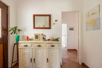 a room with a dresser with a mirror on the wall at Casa Lua in Sagres