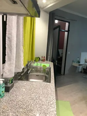 a kitchen counter with a sink in a room at STUDIO'S HOUSE in Funchal