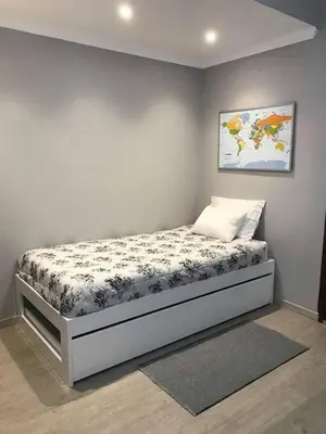 a bedroom with a bed with a map on the wall at STUDIO'S HOUSE in Funchal
