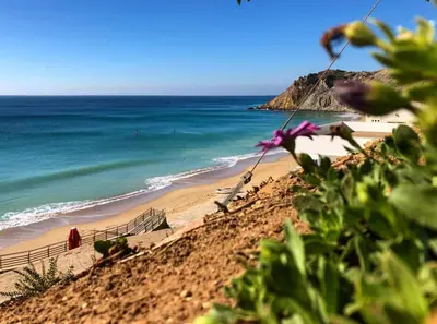 a view of a beach with the ocean at Casa Laranja, Aromas Burgau in Burgau