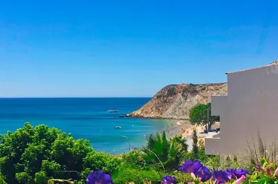 a view of a beach and the ocean at Casa Laranja, Aromas Burgau in Burgau