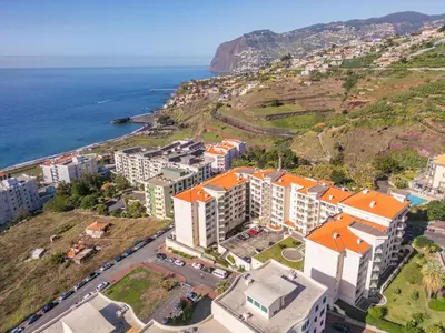 an aerial view of a city next to the ocean at Piornais by Homie in Funchal