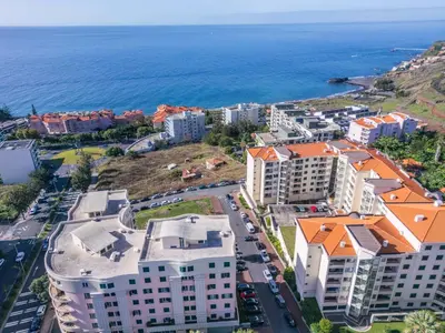 an aerial view of a city and the ocean at Piornais by Homie in Funchal
