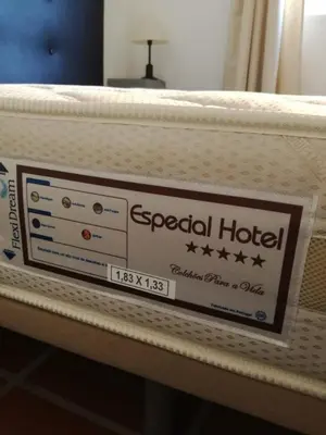 a mattress on a bed with a sign on it at Casa do Arco in Arco da Calheta