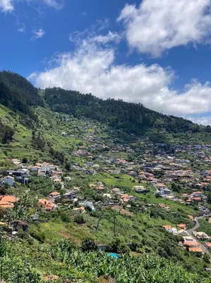 a view of a town on a hill at Casa do Arco in Arco da Calheta