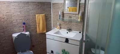 a bathroom with a sink and a toilet at Top view in Ponta do Sol