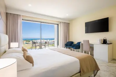 a hotel room with a large bed and a large window at Lagos Atlantic Hotel in Lagos