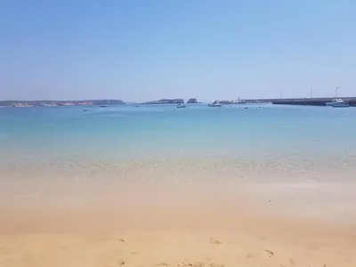 a view of a beach with boats in the water at Casa Marreiros Holiday Home in Vila do Bispo