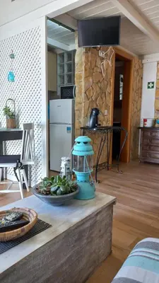 a counter with a bowl of fruit on a table at Casa Marreiros Holiday Home in Vila do Bispo