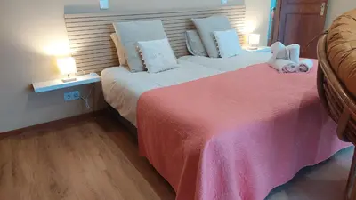 a bedroom with two beds with stuffed animals on them at Pool Villa with Botanical Garden in Funchal