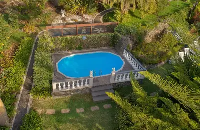 an overhead view of a swimming pool in a garden at Pool Villa with Botanical Garden in Funchal